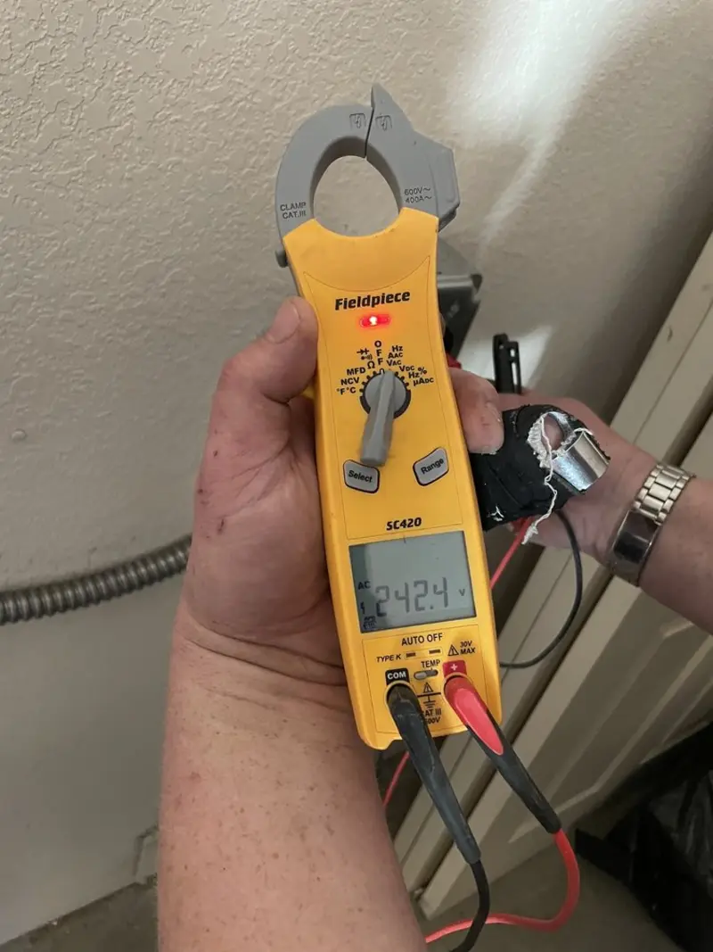 Voltage testing with clamp meter during Outlet Installation in Tanglewilde